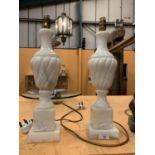 A PAIR OF CARVED MARBLE LAMPS