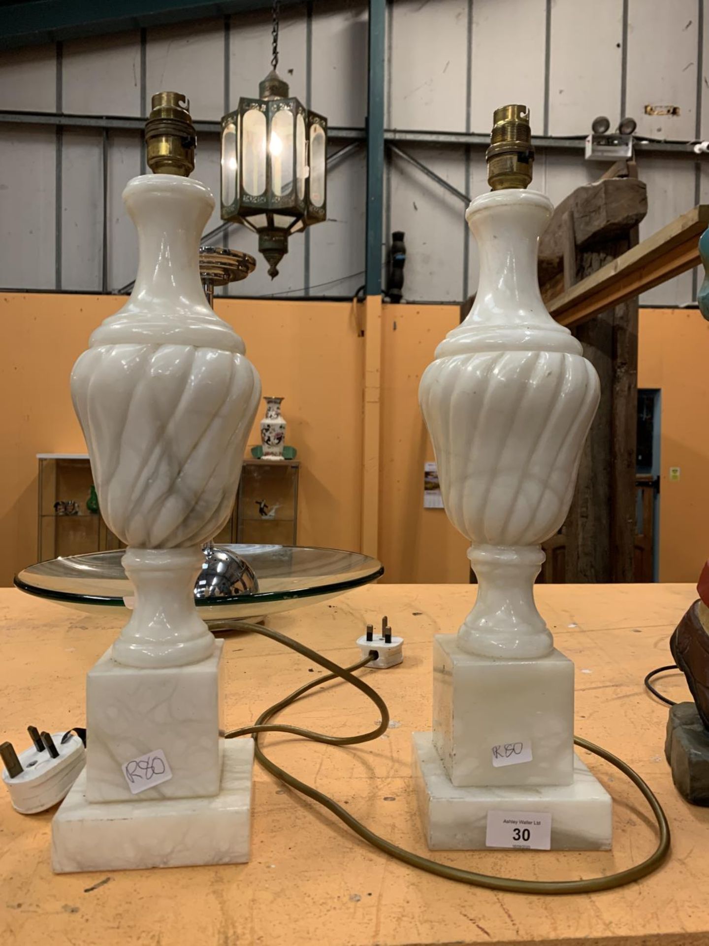 A PAIR OF CARVED MARBLE LAMPS