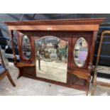 A MAHOGANY OVER MANTLE WITH CARVED AND TURNED COLUMNS AND THREE BEVEL EDGE MIRRORS