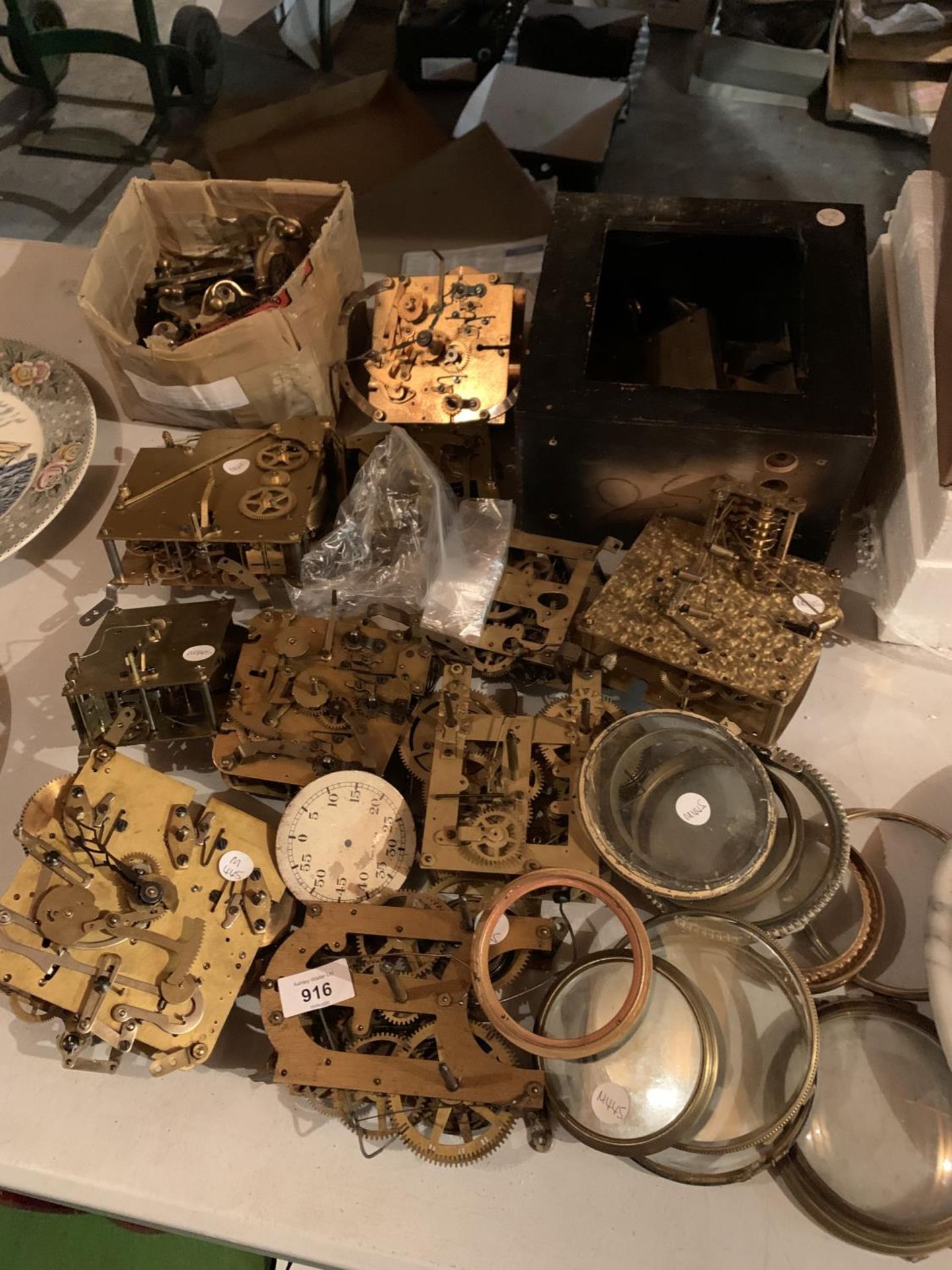 A LARGE COLLECTION OF BRASS CLOCK WORKINGS AND OTHER BRASS