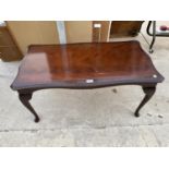 A MAHOGANY COFFEE TABLE ON CABRIOLE SUPPORTS