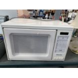 A MIELE M720 MICROWAVE, BELIEVED IN WORKING ORDER, NO WARRANTY