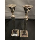 A PAIR OF HALLMARKED (INDISTINCT) CANDLESTICKS