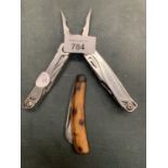 A LEATHERMAN WINGMAN MULTI TOOL AND A PENKNIFE