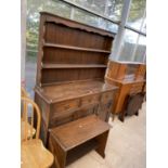 A REPRODUCTION OAK DRESSER WITH PLATE RACK AND SMALL TABLE