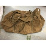 A WORLD WAR II KITBAG MARKED L E BERGIN