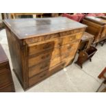 A GEORGE III OAK AND CROSSBANDED CHEST OF TWO SHORT AND THREE LONG DRAWERS