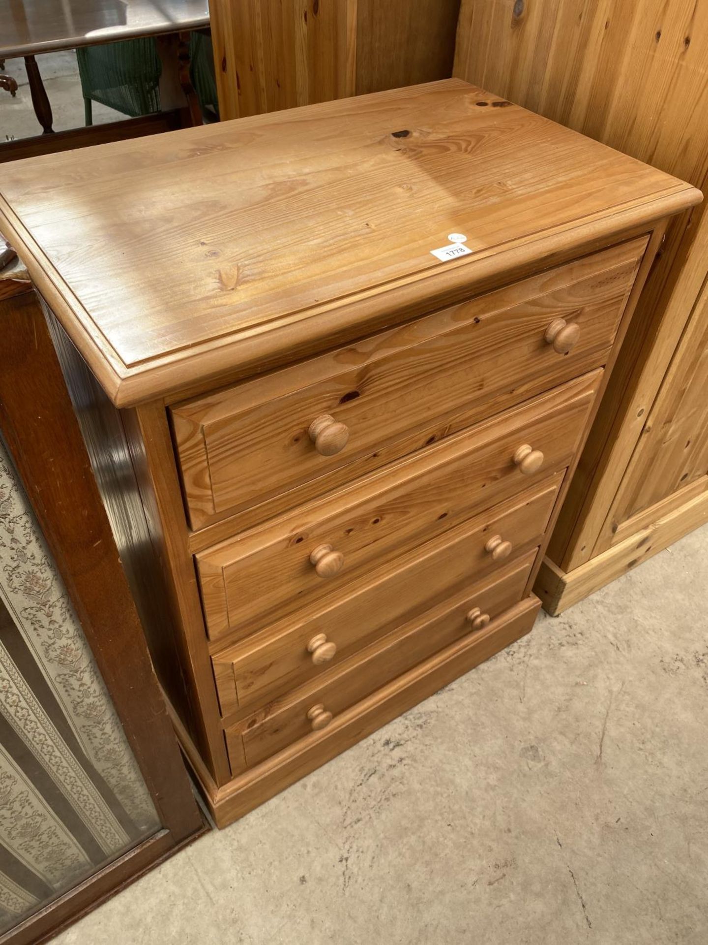 A MODERN PINE CHEST OF FOUR DRAWERS