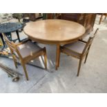 A RETRO EXTENDING TEAK DINING TABLE AND TWO DINING CHAIRS