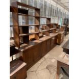 A LARGE MAHOGANY LIBRARY CABINET WITH THREE DOORS AND UPPER SHELVING