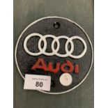 A METAL 'AUDI' PLAQUE