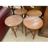 A SET OF FOUR FOLDING DROP LEAF TABLES