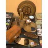 A COLLECTION OF WOODEN AND TREEN ITEMS TO INCLUDE TRAYS, CANDLESTICKS, BOOK ENDS ETC