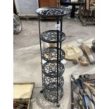 A SIX TIER METAL PAN STAND