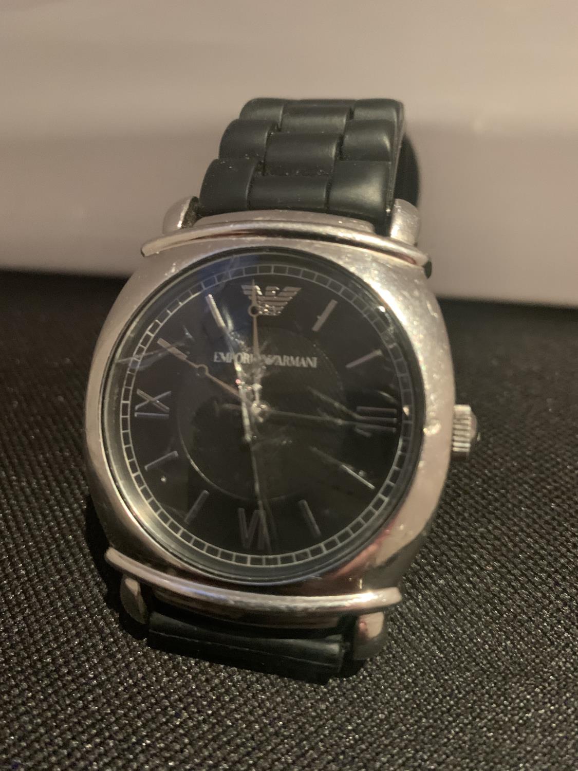 AN EMPORIA ARMANI WRIST WATCH IN WORKING ORDER A/F CRACKED GLASS