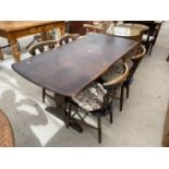 AN ERCOL REFECTORY DINING TABLE AND FOUR CHAIRS