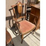 AN EDWARDIAN MAHOGANY AND INLAID ELBOW CHAIR