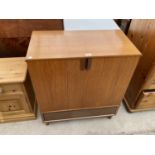 A VINTAGE TEAK G-PLAN STYLE TWO DOOR CABINET, 29" WIDE