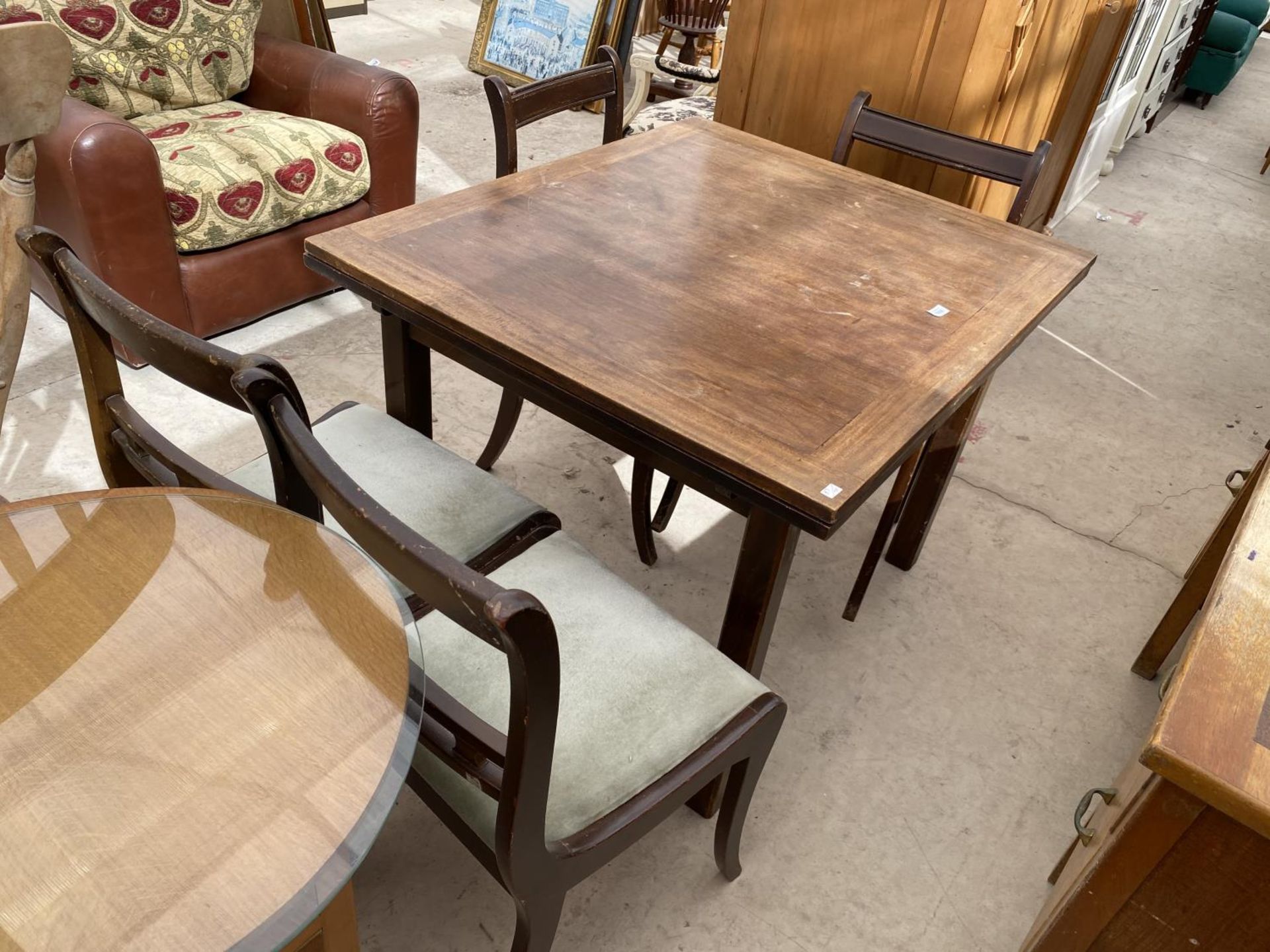 A DRAW LEAF TABLE AND FOUR CHAIRS