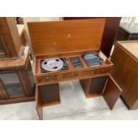 A DYNATRON RADIOGRAM WITH GARRARD DECK IN THE FORM OF A PEDESTAL DESK