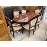 AN ITALIAN STYLE OVAL INLAID DINING TABLE TOGETHER WITH SIX BUTTON BACK DINING CHAIRS
