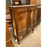 A MID 20TH CENTURY TWO DOOR OAK DISPLAY CABINET