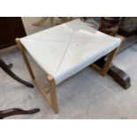 AN OAK FRAMED G-PLAN E GOMME STOOL WITH LEATHER ENVELOPE STYLE TOP