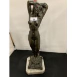 A SIGNED SPELTER FIGURE OF A NUDE WOMAN ON A MARBLE BASE