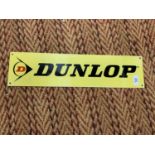 A RECTANGULAR METAL DUNLOP SIGN