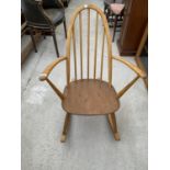 AN ERCOL ELM SEATED ARCH BACK ROCKING CHAIR