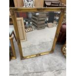 AN ORNATE GILT FRAMED MIRROR