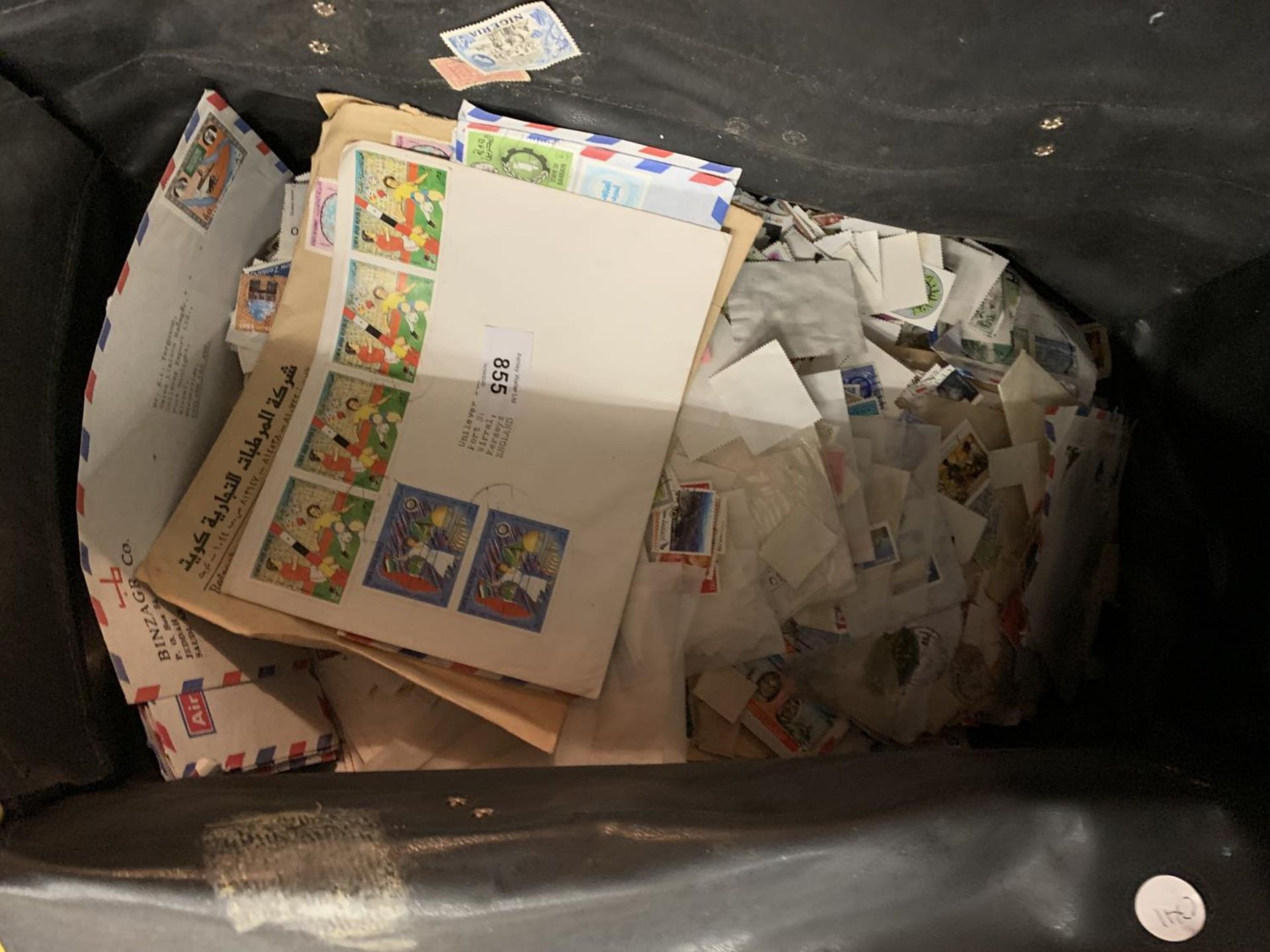 A BAG CONTAINING A LARGE COLLECTION OF STAMPS