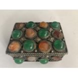 A WHITE METAL AND STONES PILL BOX