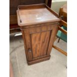 A VICTORIAN MAHOGANY POT CUPBOARD WITH GALLERY BACK