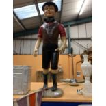 A MODEL OF A BOY IN FLAT CAP