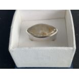 A BOXED WHITE METAL RING WITH STONE