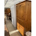 A MODERN PINE TWO DOOR WARDROBE WITH DRAWER TO BASE TOGETHER WITH A WHITE PAINTED WARDROBE