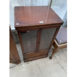 AN ANTIQUE STYLE STEREO CABINET WITH GLASS DOORS AND CD DRAWER TO BASE