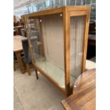 A SATINWOOD DISPLAY CABINET WITH TWO GLAZED SIDE DOORS