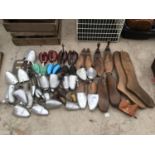 A VINTAGE COLLECTION OF WOODEN AND METAL SHOE STRETCHERS