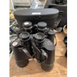 A SET OF BOOTS BINOCULARS 12X50MM AND A SET OF SUPER ZENITH BINOCULARS 10X50MM