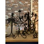 A TRIO OF BLACK METAL CANDELABRA TO INCLUDE ONE SEVEN STEM