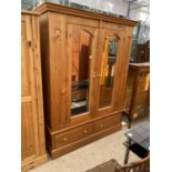 A MODERN PINE DOUBLE MIRROR DOOR WARDROBE