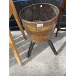 A BRASS BANDED OAK BARREL PLANTER