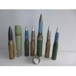 A COLLECTION OF SIX INERT SHELLS TO INCLUDE AN OERLIKAN 35MM FROM THE FALKLANDS, PART OF A WWII