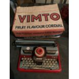 A VINTAGE METTOY MINOR TOY TYPEWRITER MADE IN GREAT BRITAIN AND A VIMTO CORDIAL ADVERTISING