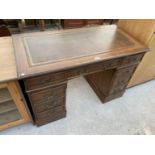 A REPRODUCTION DOUBLE PEDESTAL DESK WITH INSET LEATHER TOP 47"x22"