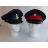 A YORKSHIRE REGIMENT PEAKED CAP AND A ROYAL ANGLIAN REGIMENT CAP