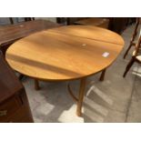 AN ERCOL EXTENDING DINING TABLE ON TAPERED LEGS