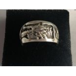 AN ORIENTAL SILVER DRAGON RING